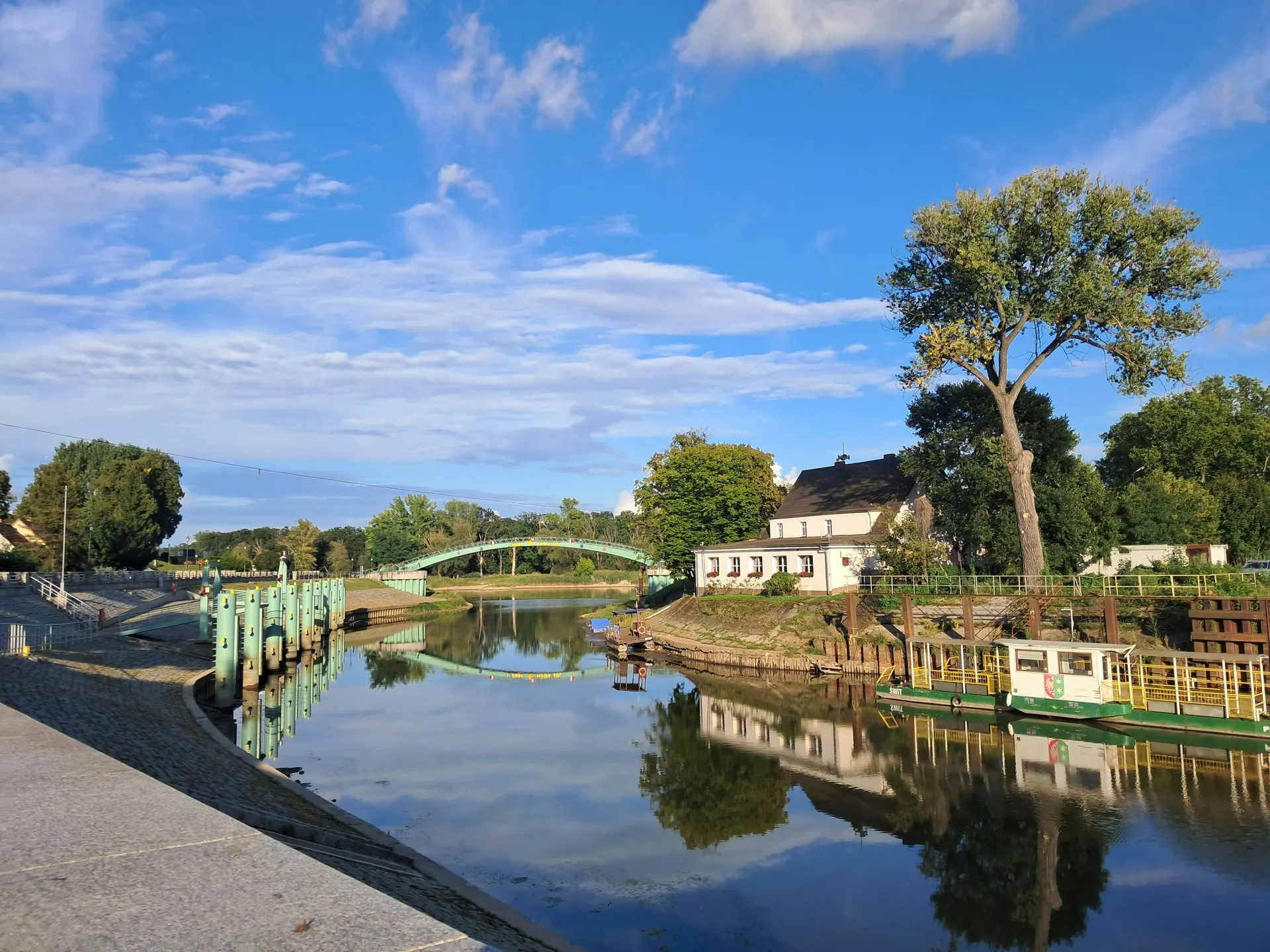 Boat trip on a calm Irish river with town quay views